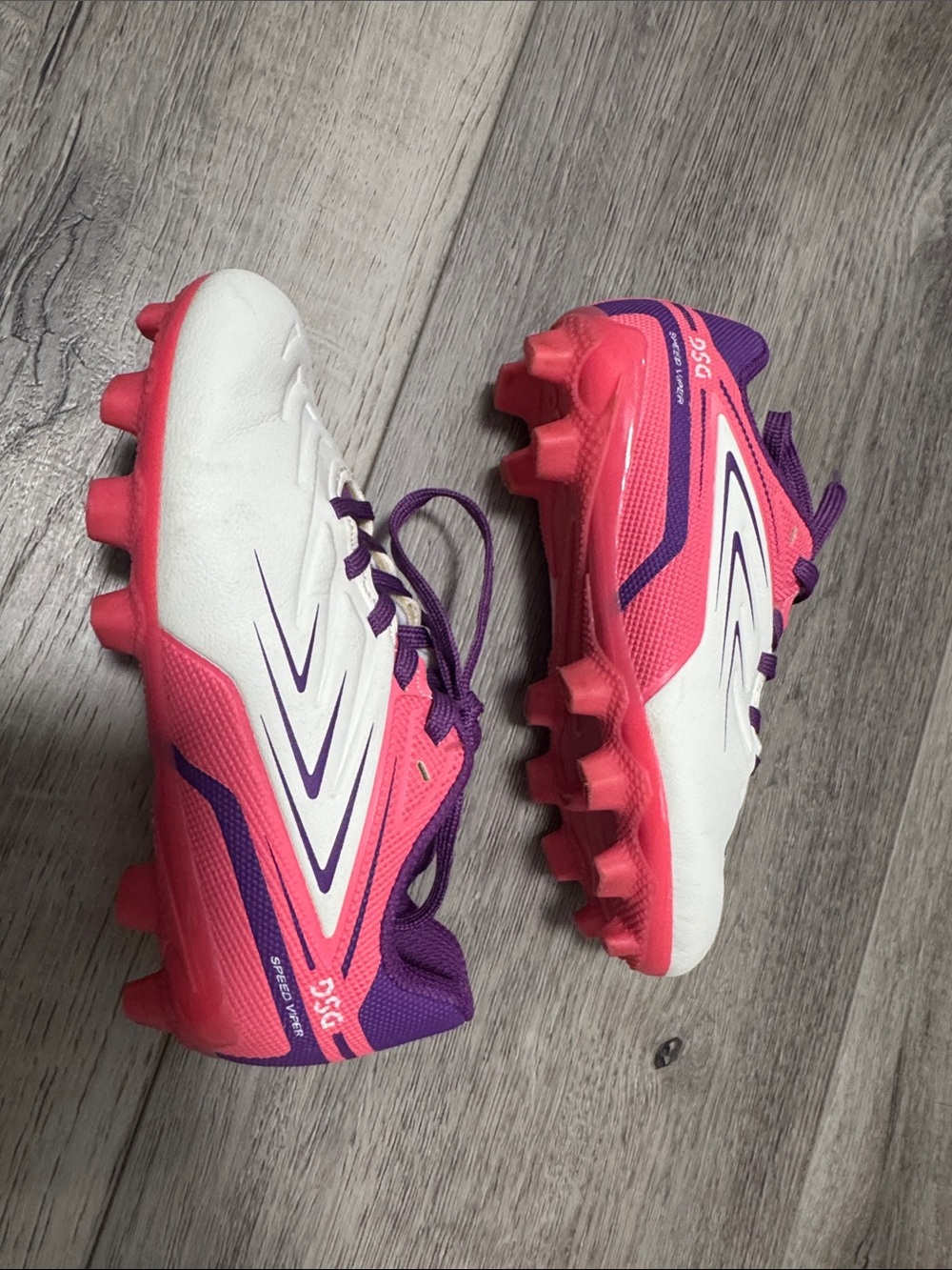 DSG Pink Soccer Cleats with Purple Accents